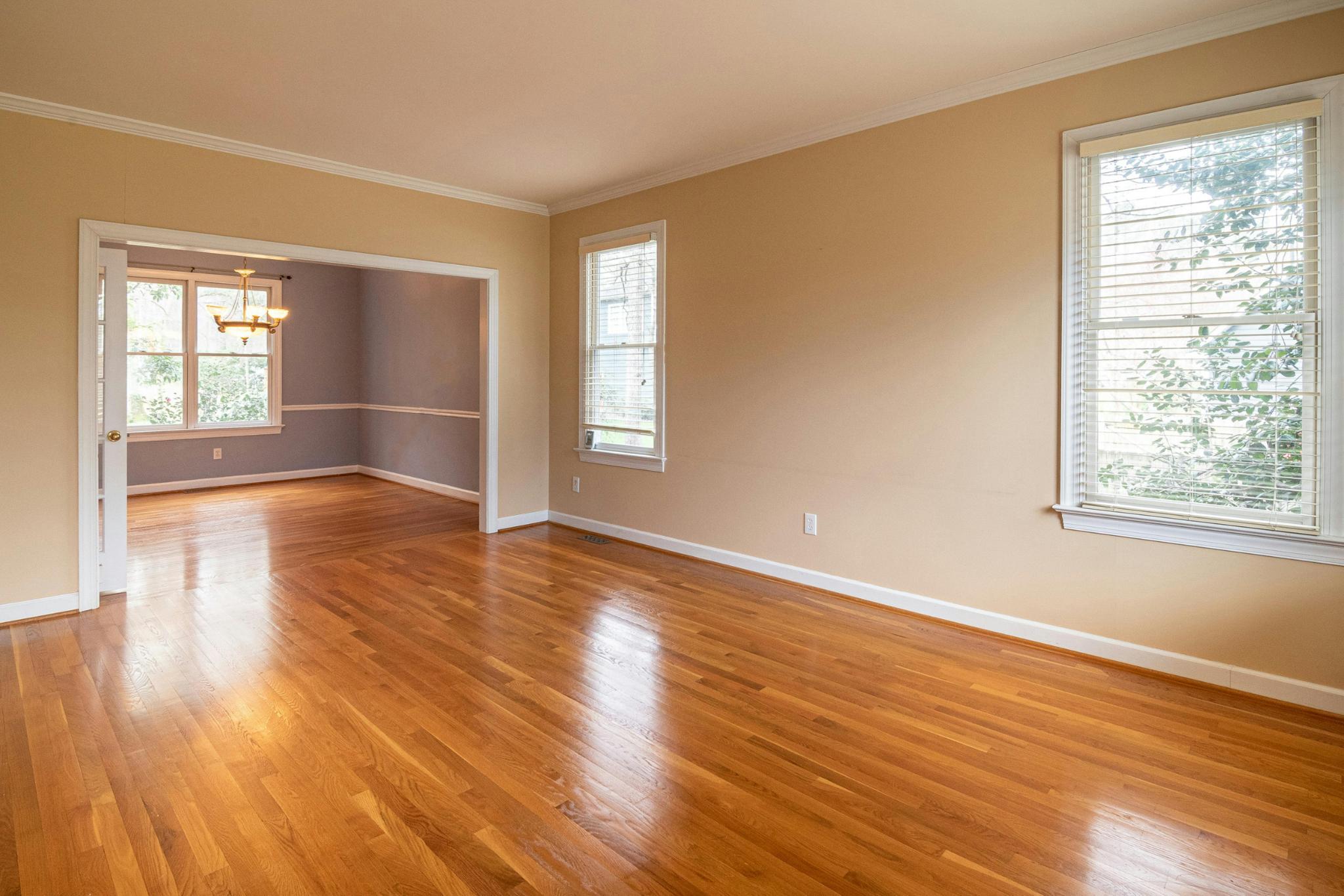 Sun-Drenched Living Space with Gleaming Hardwood Floors