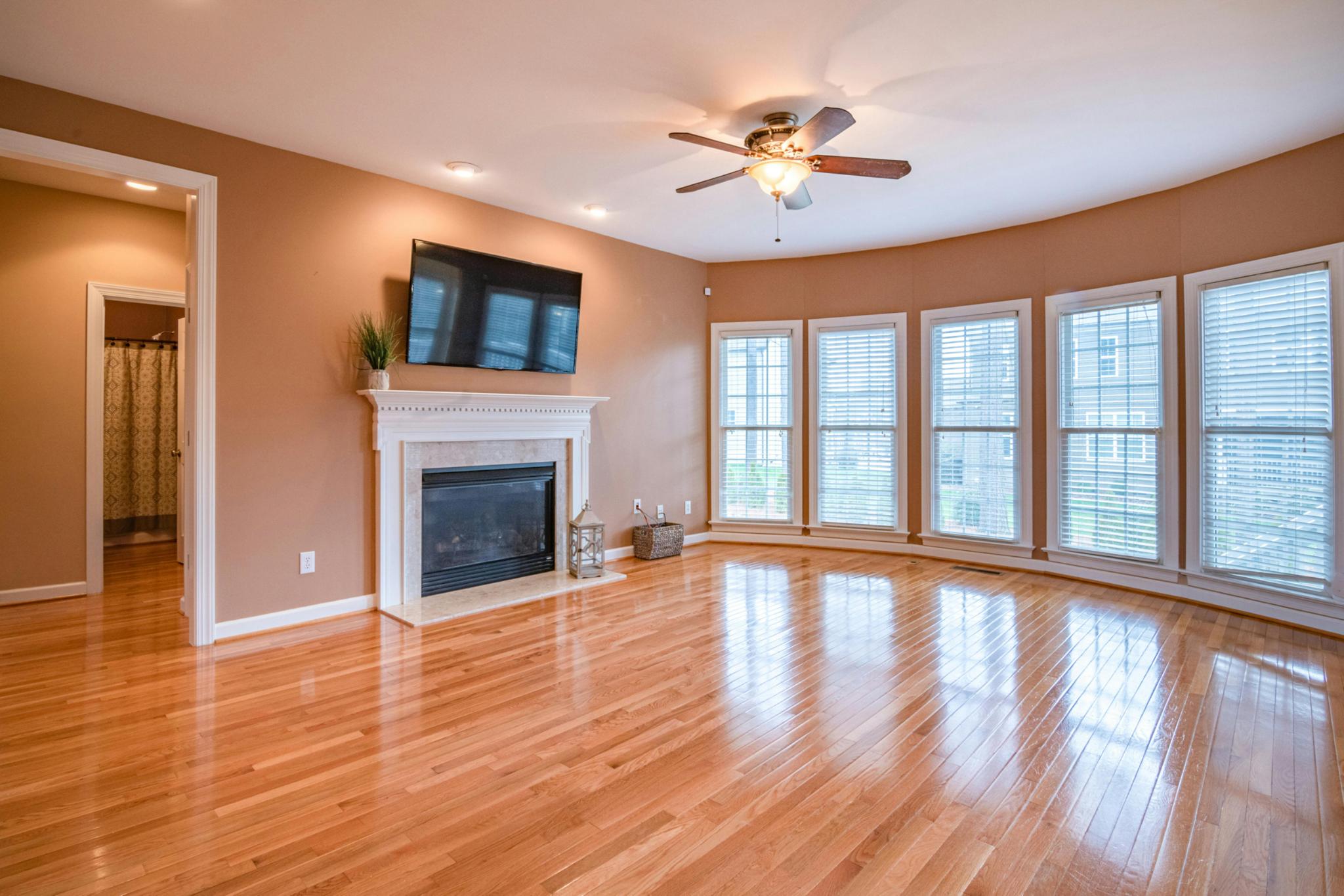 Bright & Airy Family Room with Fireplace and Hardwood Floors